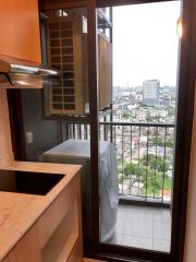 Compact kitchen corner with a view of the city overlooking a busy urban area