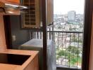 Compact kitchen corner with a view of the city overlooking a busy urban area