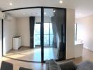 Spacious modern apartment interior with open plan kitchen, large windows, and abundant natural light