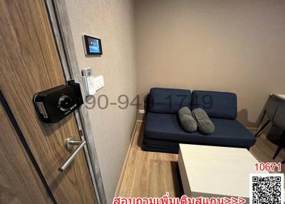 Compact living room with modern sofa and digital security door lock
