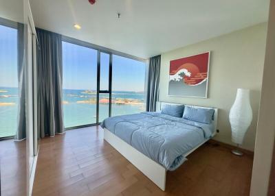 Modern bedroom with ocean view and ample natural light