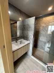 Modern bathroom with glass shower and elegant basin