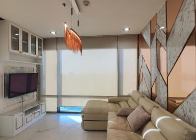 Modern living room with marble walls and large sofa