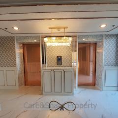 Luxurious lobby area with marble floors and elegant chandelier