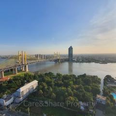 Expansive river view with bridge and surrounding cityscape