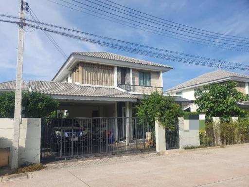 Suburban two-story house with a gated entrance