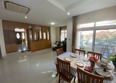 Spacious dining room with large table and natural light