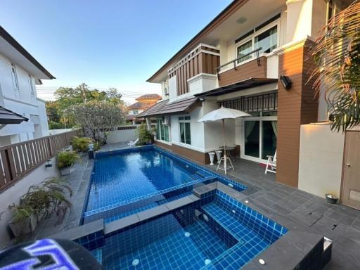 Luxury house with swimming pool in backyard