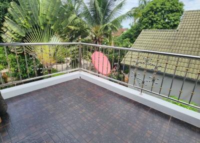 Spacious balcony with tropical view and tile flooring