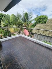 Spacious balcony with tropical view and tile flooring