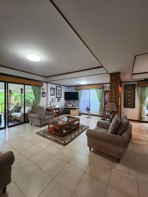 Spacious living room with modern furniture and natural lighting