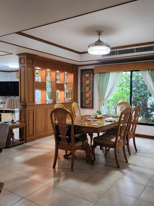 Elegant dining room with natural light and traditional wood furniture