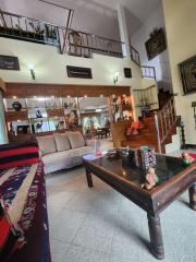 Spacious Living Room with High Ceilings and Mezzanine