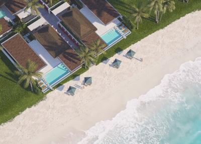 Aerial view of a beachfront property with swimming pool