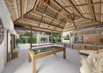 Spacious entertainment area with pool table, thatched roof and open layout