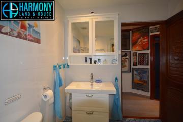 Modern bathroom interior with vanity cabinet and mirror