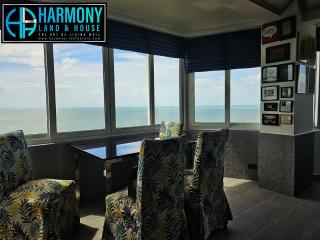 Cozy living room with ocean view and ample seating