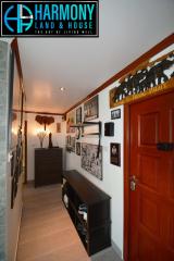 Welcoming entryway with decorative elements and red door