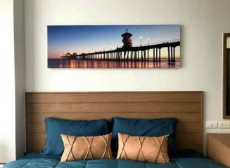 Cozy bedroom interior with artwork above the bed