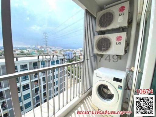 Balcony with city view, air conditioning units, and washing machine