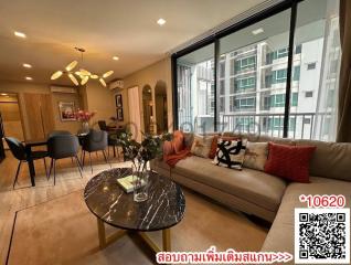 Modern living room with ample seating and natural light