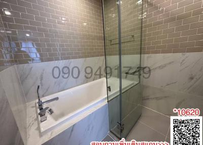 Modern bathroom with tub and glass shower enclosure