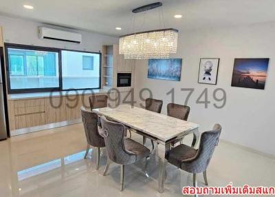 Modern kitchen with dining area and marble table