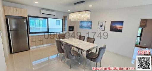 Modern kitchen with dining area and marble table