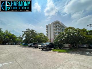 Parking area outside a modern residential building with clear blue skies