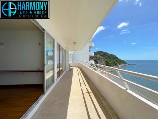 Spacious balcony with ocean view and clear skies