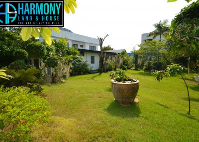 Spacious backyard garden with lush greenery and landscaping