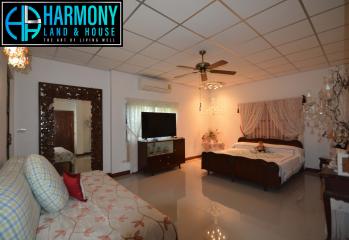 Spacious bedroom with a queen-sized bed and modern amenities