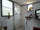 Modern bathroom interior with white and decorative tiling
