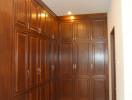 Spacious interior hallway with wooden cabinetry