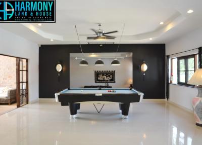 Spacious recreation room with pool table and contemporary design