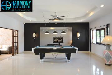 Spacious recreation room with pool table and contemporary design