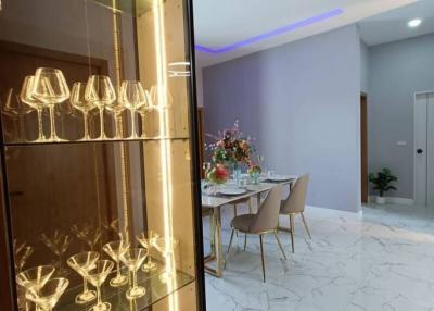 Elegant dining area with mood lighting and marble flooring