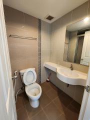 Modern bathroom interior with tiled walls and floors