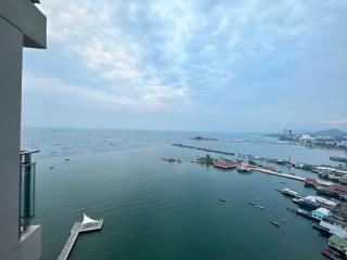 Panoramic sea view from high-rise apartment balcony