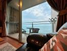 Cozy living room with a sea view and balcony access