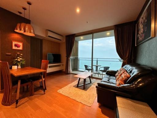 Cozy living room with ocean view through large windows