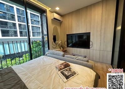 Modern bedroom with large window and city view