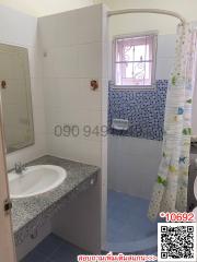 Modern bathroom interior with shower curtain and tiled walls
