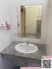 Compact bathroom with mirror and sink