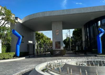 Modern building entrance with unique blue sculptures