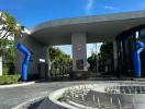 Modern building entrance with unique blue sculptures