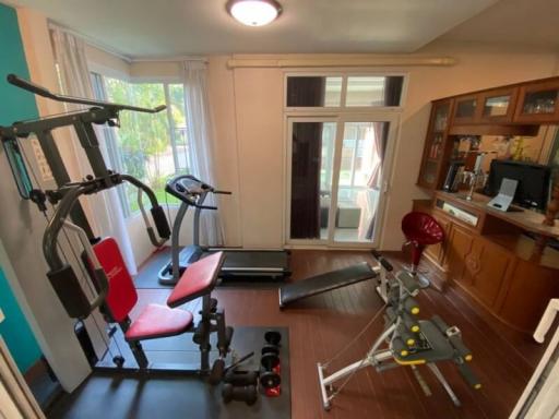 Home gym room with various exercise equipment