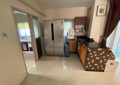 Modern kitchen with stainless steel appliances and tiled backsplash