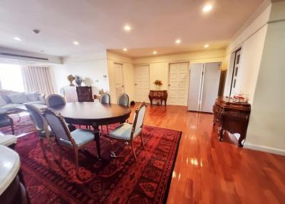 Spacious dining room with large table and hardwood floors
