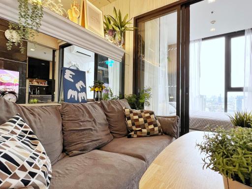 Cozy Living Room with Large Window and City View
